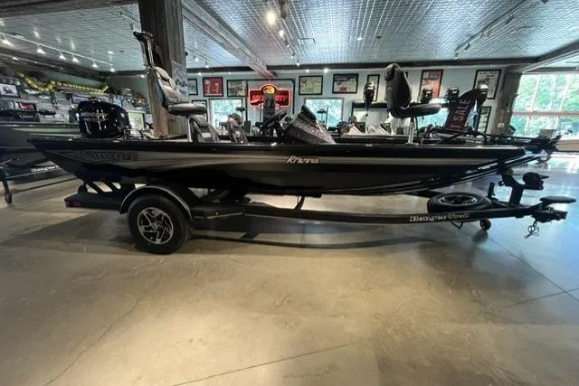 The Image of 2026 Ranger RT178 boat displayed indoors on a trailer. - 0