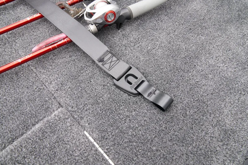 Slide: The Image of 2026 Ranger RT188P boat deck with Garmin navigation system, featuring gray carpeting and storage compartments. - 12