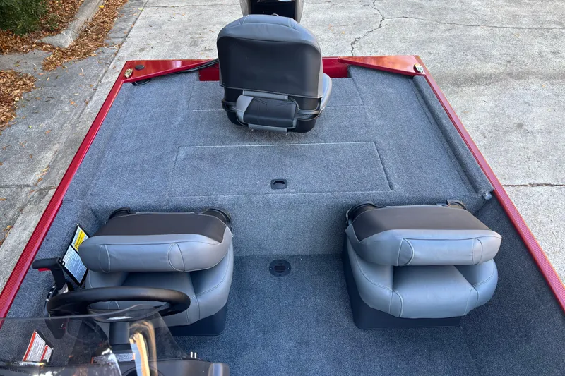 Slide: The Image of 2026 Tracker Bass Tracker Classic XL boat interior with gray seating and carpeted deck. - 5
