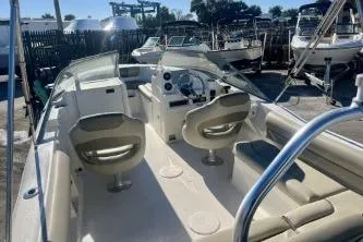 Slide: The Image of 2023 Key West 203 DFS boat interior with dual seats and steering console. - 7