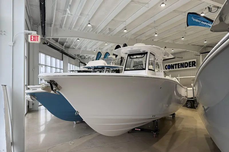 The Image of 2026 Sportsman Open 282 Center Console boat displayed in a showroom. - 0