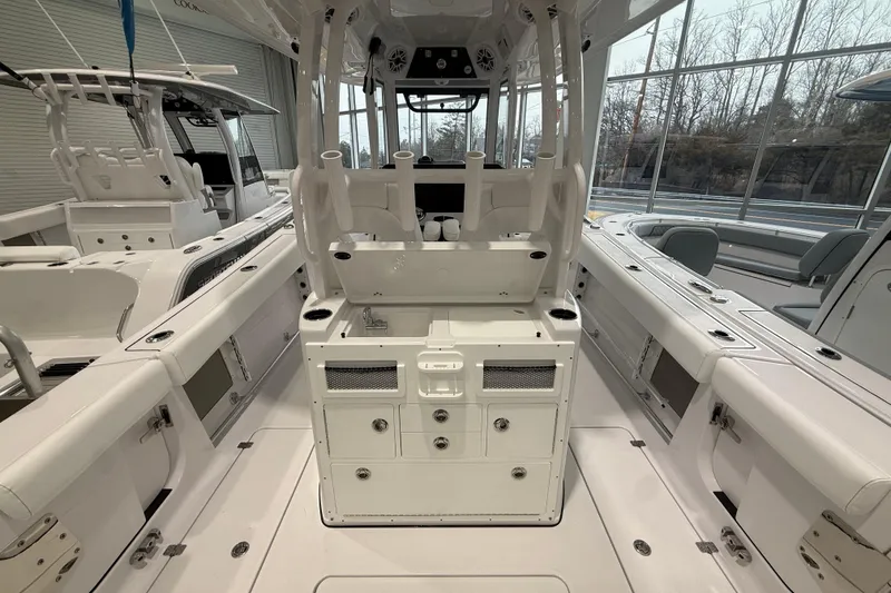 Slide: The Image of 2026 Sportsman Open 282 Center Console boat interior with seating and storage features. - 9
