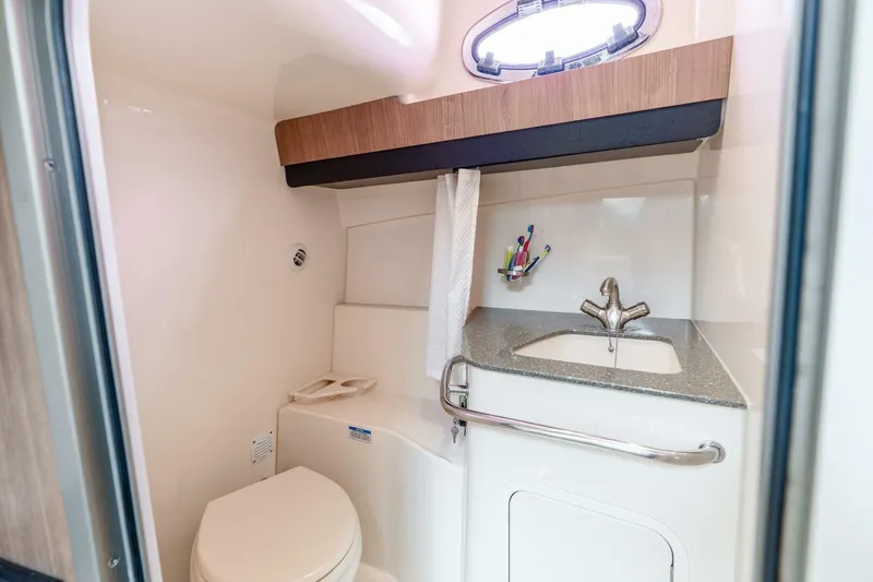 Slide: The Image of Bathroom interior of 2012 Boston Whaler 345 Conquest with sink and toilet. - 17