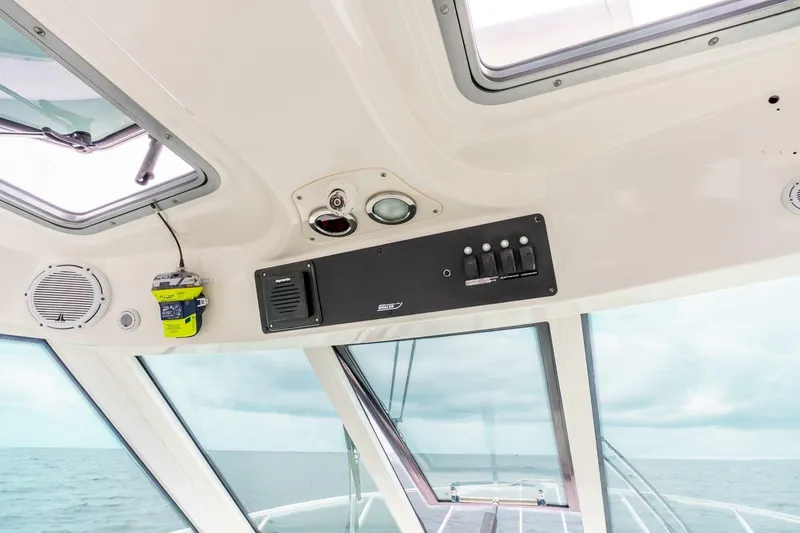 Slide: The Image of Interior view of 2012 Boston Whaler 345 Conquest boat cockpit with control panel. - 9