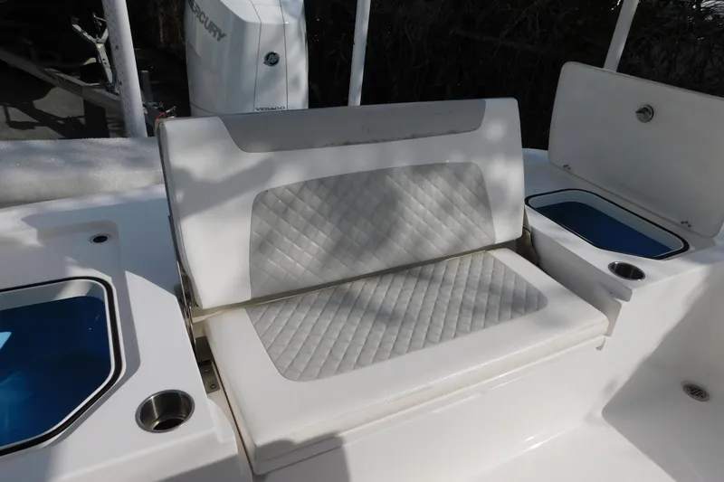 Slide: The Image of 2023 Caymas 28 HB boat seat with quilted design and storage compartments. - 17