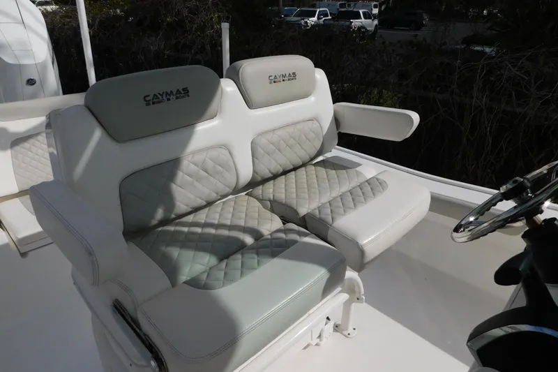 Slide: The Image of 2023 Caymas 28 HB boat seating with quilted upholstery and armrests. - 2