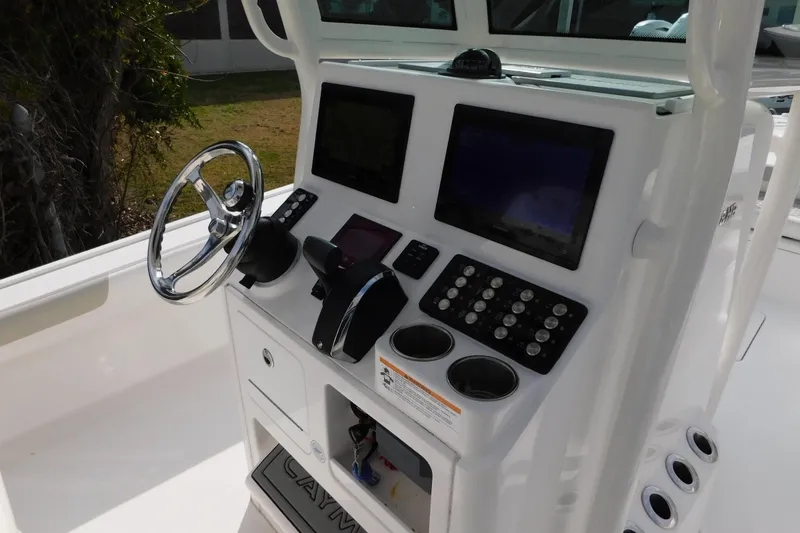 Slide: The Image of 2023 Caymas 28 HB boat console with steering wheel and electronic displays. - 3