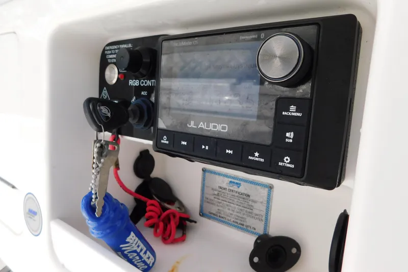 Slide: The Image of 2023 Caymas 28 HB boat audio system with JL Audio controls and keychain. - 31