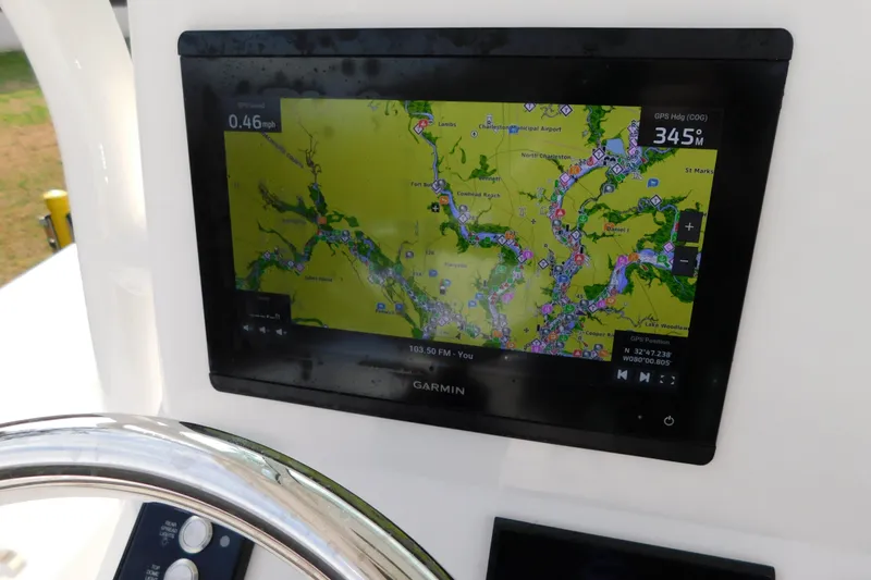 Slide: The Image of Garmin navigation display on 2023 Caymas 28 HB boat, showing detailed map and GPS data. - 32