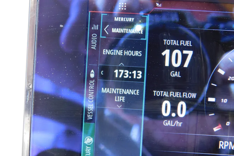 Slide: The Image of Display screen of 2023 Caymas 28 HB showing engine hours and fuel data. - 36