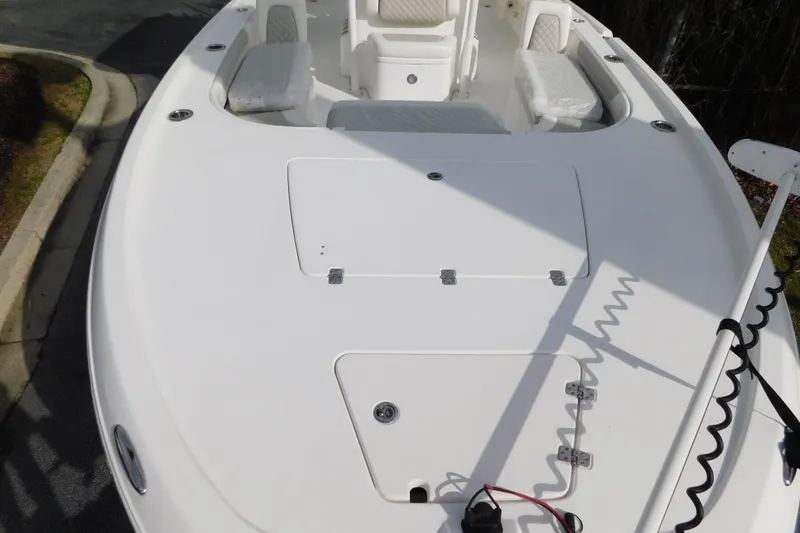 Slide: The Image of 2023 Caymas 28 HB boat deck with seating and storage compartments. - 5