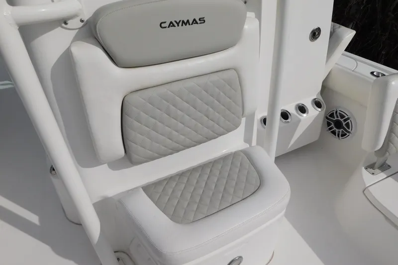 Slide: The Image of 2023 Caymas 28 HB boat seat with quilted upholstery and integrated rod holders. - 6