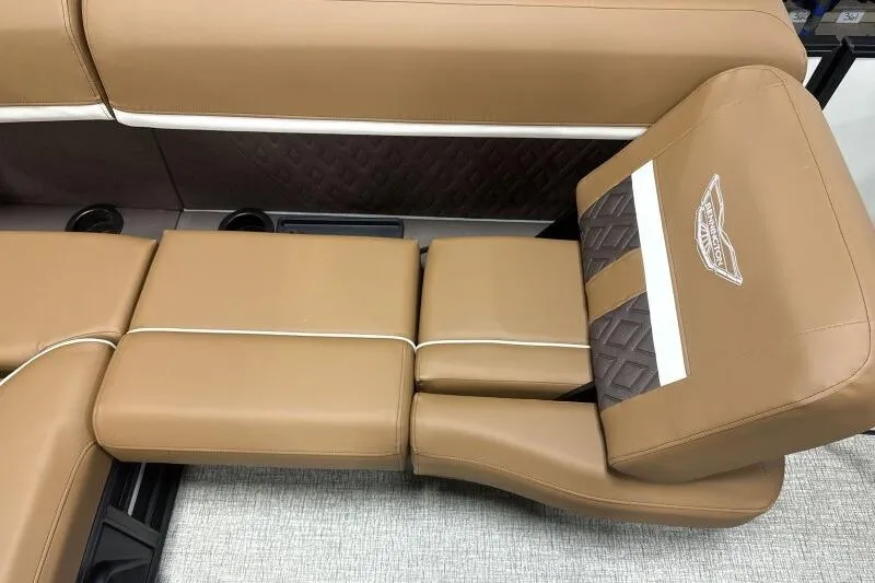 Slide: The Image of Luxurious tan seating in 2026 Bennington 22 MSBSF boat, featuring elegant stitching and logo. - 10