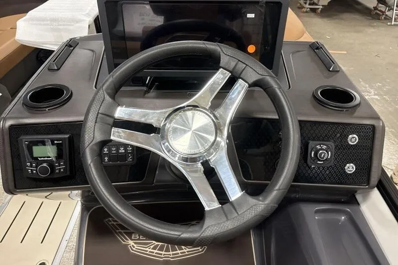 Slide: The Image of 2026 Bennington 22 MSBSF boat dashboard with modern steering wheel and controls. - 12
