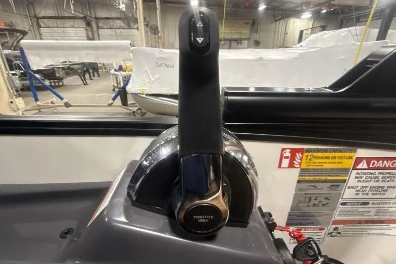 Slide: The Image of Throttle control of 2026 Bennington 22 MSBSF boat in a workshop setting. - 13