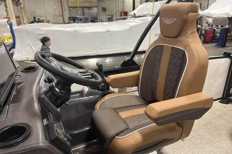 Slide: The Image of Captain's chair and helm of 2026 Bennington 22 MSBSF boat, featuring luxurious design. - 14