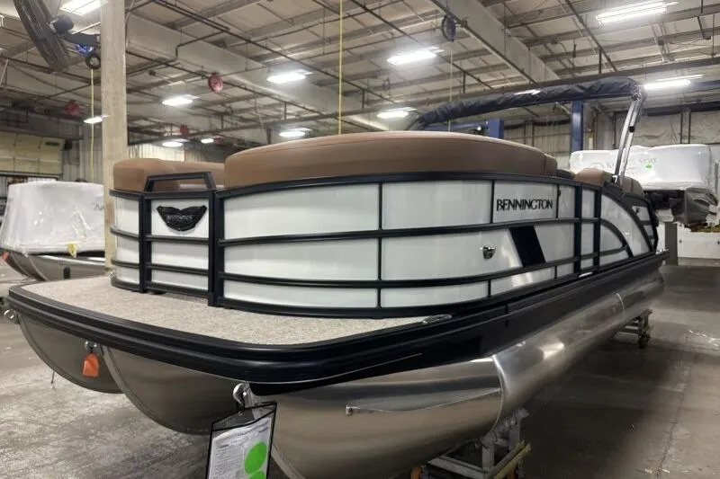 Slide: The Image of 2026 Bennington 22 MSBSF pontoon boat in a warehouse setting. - 3