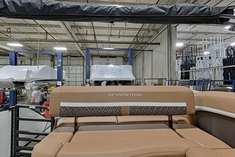 Slide: The Image of 2026 Bennington 22 MSBSF boat interior in a manufacturing facility. - 7
