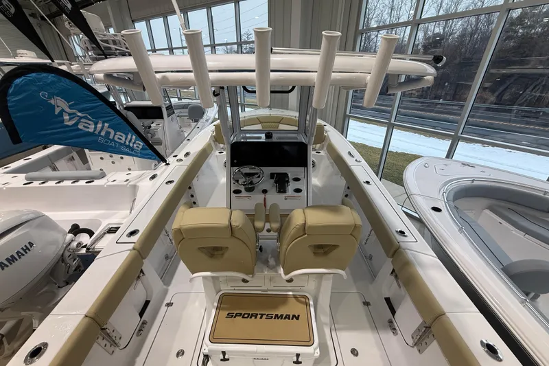 Slide: The Image of 2026 Sportsman Heritage 261 Center Console boat interior with dual seats and steering console. - 36