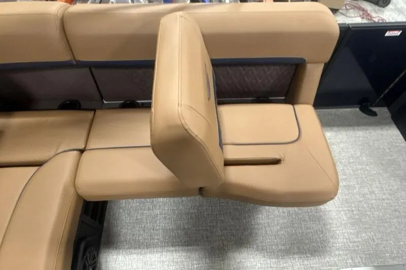 Slide: The Image of 2026 Bennington 22 MSBSF boat interior with tan seating and adjustable backrest. - 12