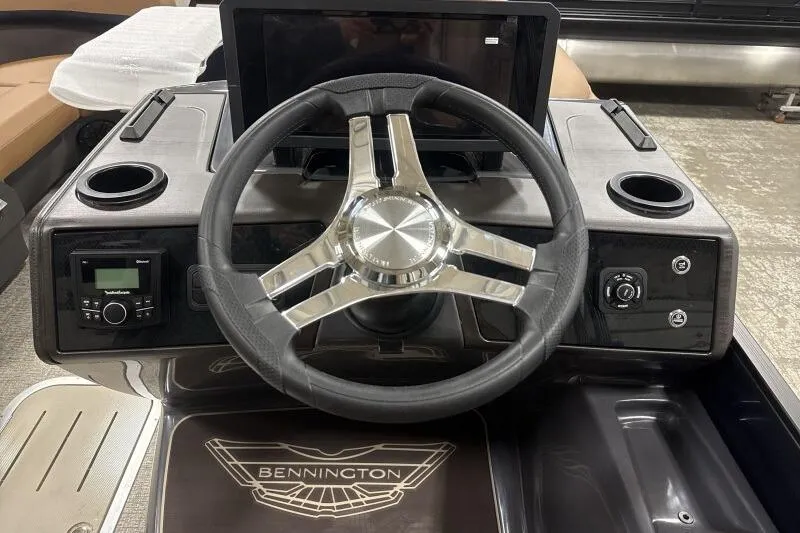Slide: The Image of Steering console of 2026 Bennington 22 MSBSF boat with modern controls and logo. - 14