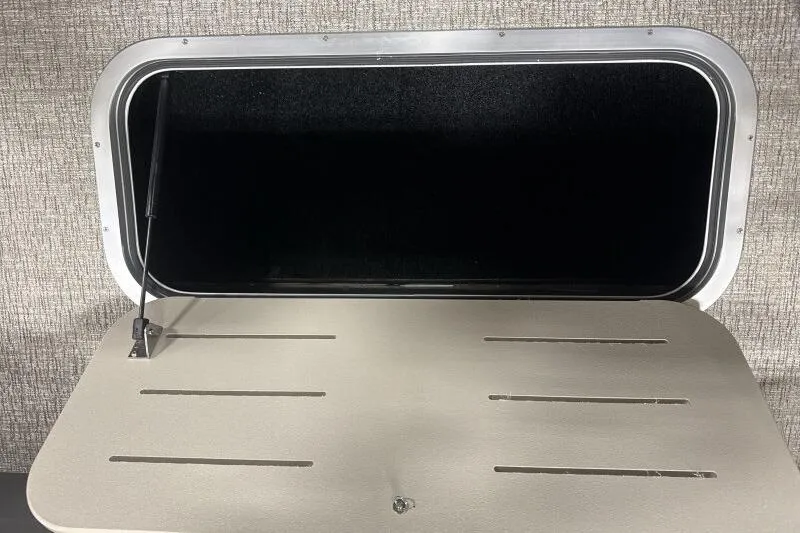 Slide: The Image of Open storage compartment in 2026 Bennington 22 MSBSF boat interior. - 17