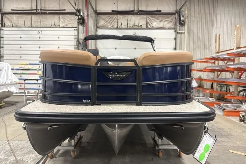 Slide: The Image of 2026 Bennington 22 MSBSF pontoon boat in a workshop setting. - 2