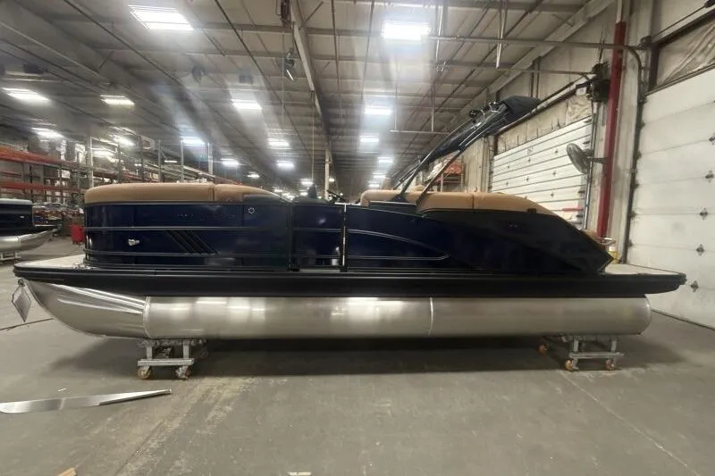 Slide: The Image of 2026 Bennington 22 MSBSF pontoon boat in a warehouse setting. - 3