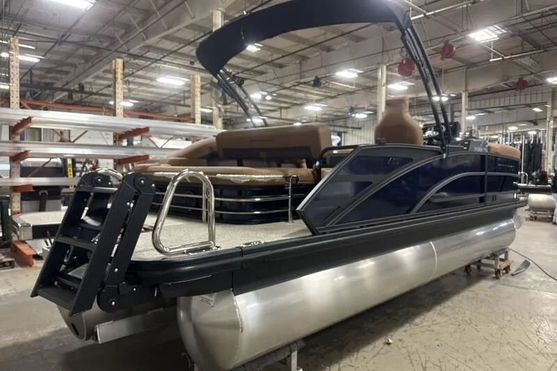 Slide: The Image of 2026 Bennington 22 MSBSF pontoon boat in a warehouse setting. - 4