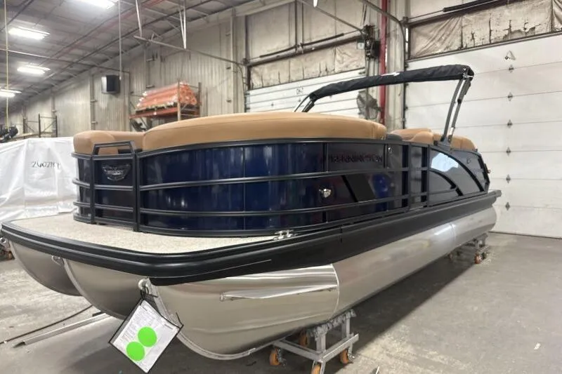 Slide: The Image of 2026 Bennington 22 MSBSF pontoon boat in a warehouse setting. - 6