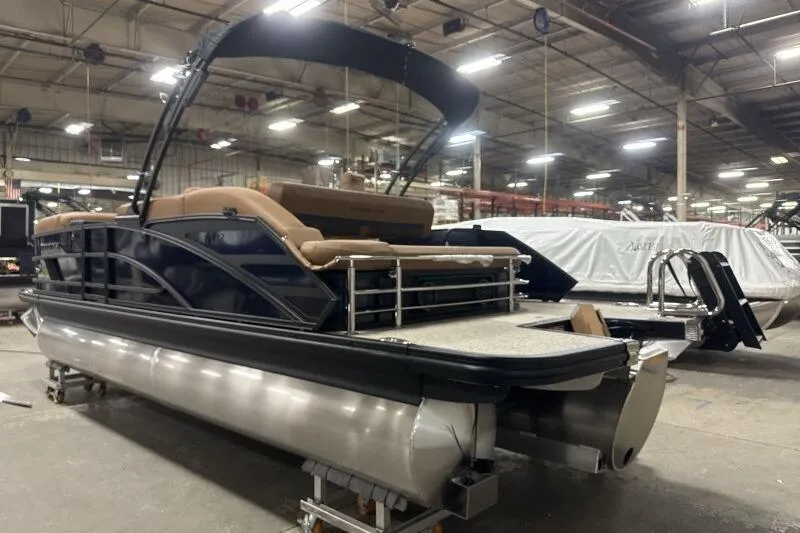 Slide: The Image of 2026 Bennington 22 MSBSF pontoon boat in a factory setting, showcasing sleek design. - 7