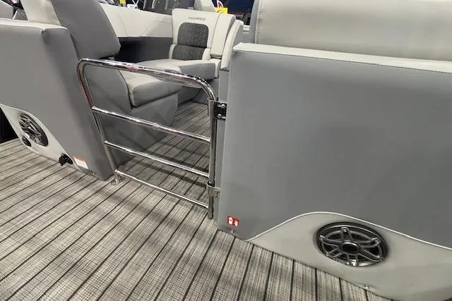 Slide: The Image of Interior of 2026 Harris Solstice 230 CWDH pontoon boat with gray seating and flooring. - 16