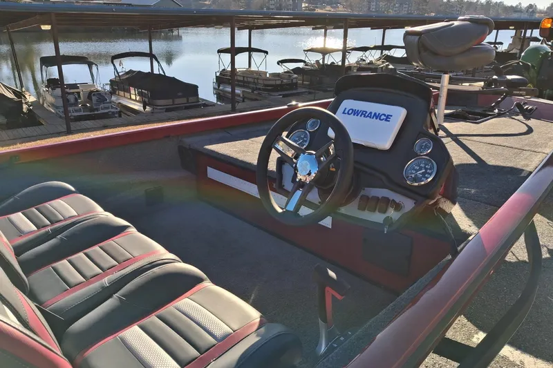 Slide: The Image of 2023 Ranger RT188 boat interior with steering wheel and Lowrance electronics. - 5