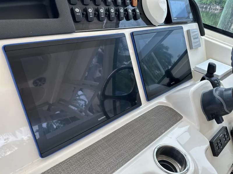 Slide: The Image of Control panel of 2017 Grady-White Freedom 375 boat with dual Garmin displays. - 14