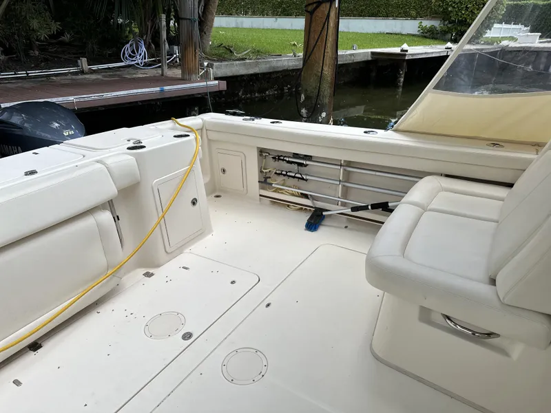 Slide: The Image of 2017 Grady-White Freedom 375 boat interior with seating and fishing rod storage. - 28