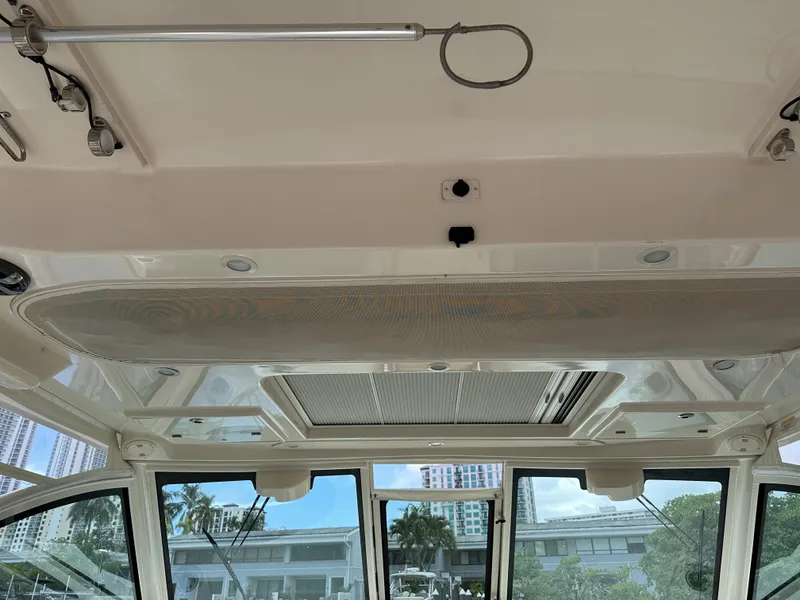 Slide: The Image of Interior view of 2017 Grady-White Freedom 375 boat, showcasing ceiling and windows. - 36