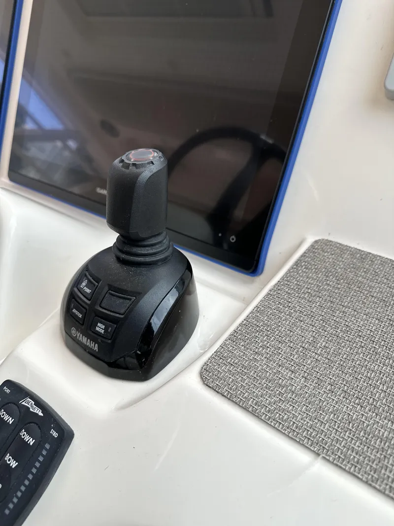 Slide: The Image of Joystick control on 2017 Grady-White Freedom 375 boat dashboard. - 38