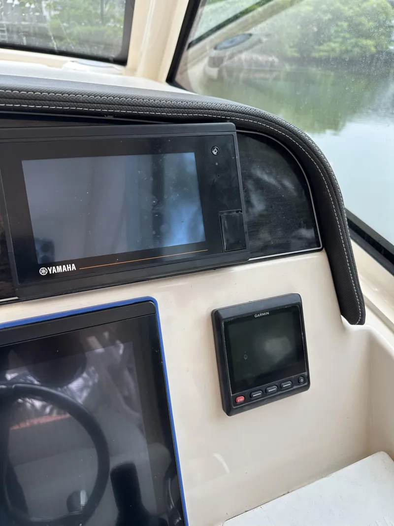 Slide: The Image of Dashboard of 2017 Grady-White Freedom 375 boat with Yamaha and Garmin displays. - 41