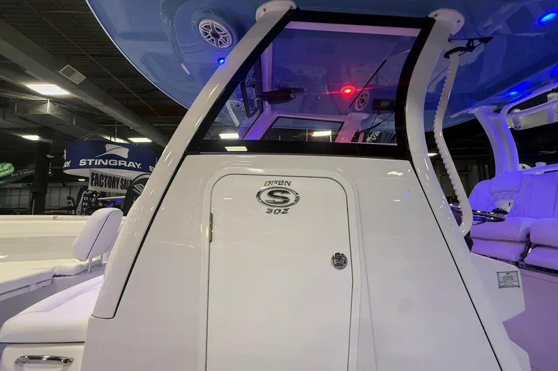 Slide: The Image of 2026 Sportsman Open 302 Center Console boat interior with modern design and lighting. - 13