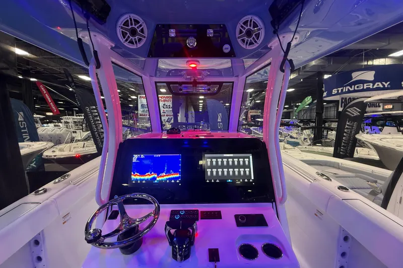 Slide: The Image of 2026 Sportsman Open 302 Center Console boat interior with advanced navigation system. - 2