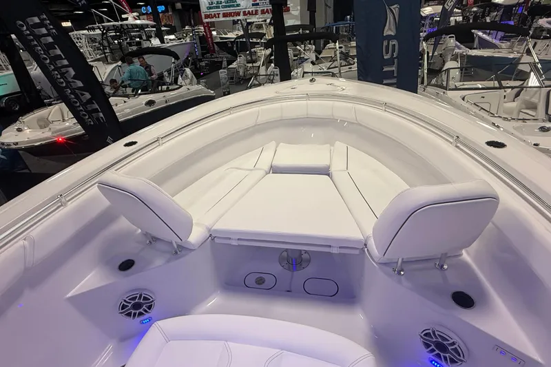 Slide: The Image of 2026 Sportsman Open 302 Center Console boat interior at a boat show. - 6