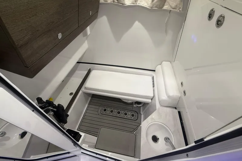 Slide: The Image of 2026 Sportsman Open 302 Center Console interior with seating and storage. - 7