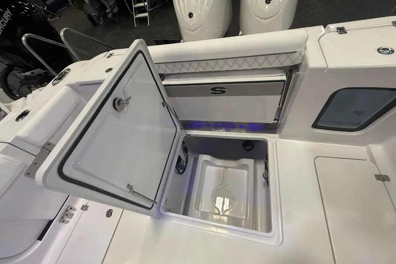 Slide: The Image of 2026 Sportsman Open 302 Center Console boat with open storage compartment. - 8