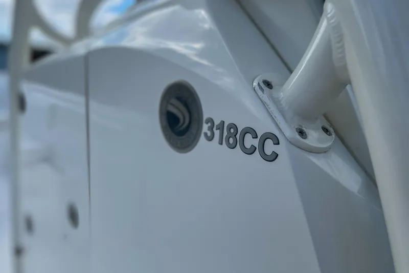 Slide: The Image of Close-up of 2011 Edgewater 318CC boat emblem and model name. - 11