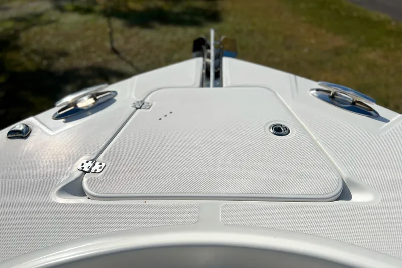 Slide: The Image of Bow of 2011 Edgewater 318CC boat with hatch and cleats. - 25