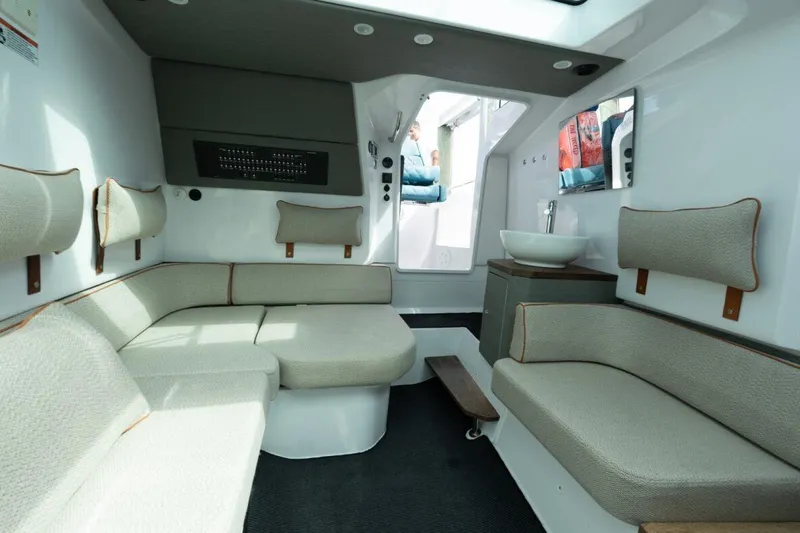 Slide: The Image of Luxurious interior of 2021 Axopar 37 Sun-Top with modern seating and sleek design. - 11