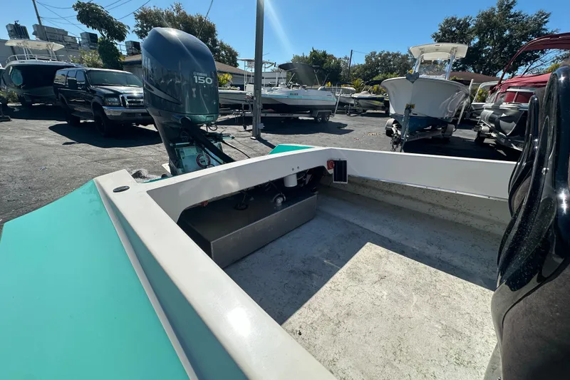 Slide: The Image of 2022 Lightning 18 boat with Yamaha 150 engine in a sunny outdoor setting. - 9