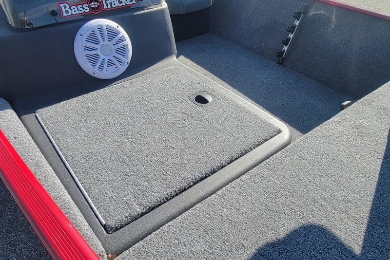 Slide: The Image of 2024 Tracker Bass Tracker Classic XL boat interior with speaker and storage compartment. - 12