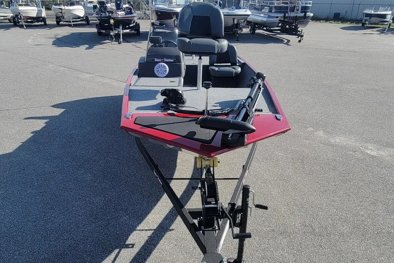 Slide: The Image of 2024 Tracker Bass Tracker Classic XL boat in a parking lot, front view. - 4