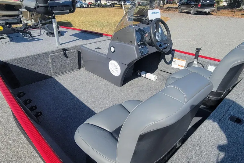 Slide: The Image of 2024 Tracker Bass Tracker Classic XL boat interior with steering console and seating. - 7